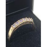 9 carat GOLD RING having Gemstone detail set to top. Full UK hallmark. 2.64 grams. Size T.