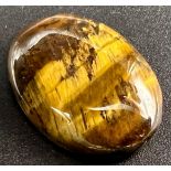 25.40 Ct Natural Tiger Eye. Yellow Brown. Oval Cabochon. Comes with GLI Certificate.