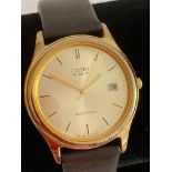 Gentlemans CITIZEN QUARTZ Wristwatch in Gold tone. having date window and sweeping second hand.