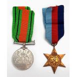 2 WWII MEDALS WITH ORIGINAL RIBBONS,THE DEFENCE MEDAL PLUS A 1939 - 1945 STAR.