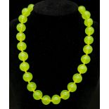 A Peridot Gemstone Large Bead Necklace. Gilded clasp. Necklace length - 44cm.