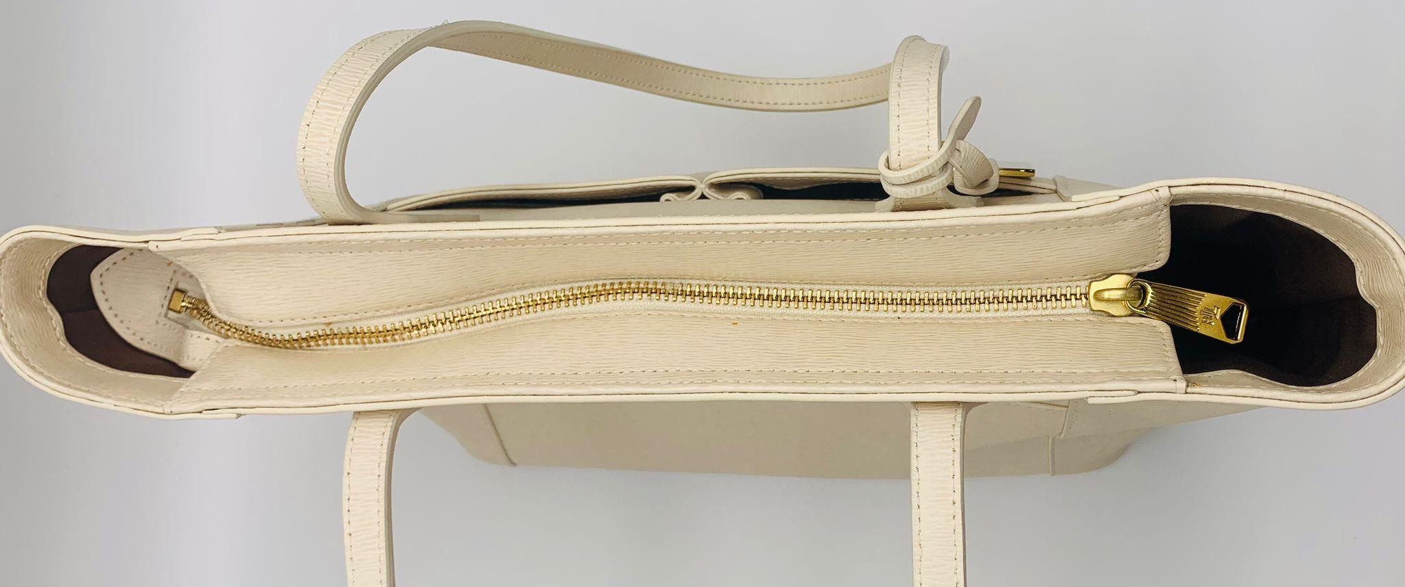 A Ralph Lauren Cream Leather Handbag. Two exterior flaps. Zipped inner compartment. 36cm width. 26cm - Image 5 of 12