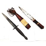 A Vintage Commando Dagger - 29cm plus an Antique African Tribal Dagger in sheaf - 29cm.