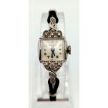 A VINTAGE 14K WHITE GOLD BULOVA LADIES WRIST WATCH IN ART DECO DESIGN , GOOD WORKING ORDER A