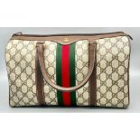 A Gucci Doctor Satchel Bag. Monogram canvas and trimmed brown leather. Zipped interior