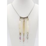 A Swarovski Mother of Pearl and Multi-Coloured Stone Necklace. In original Swarovski case.