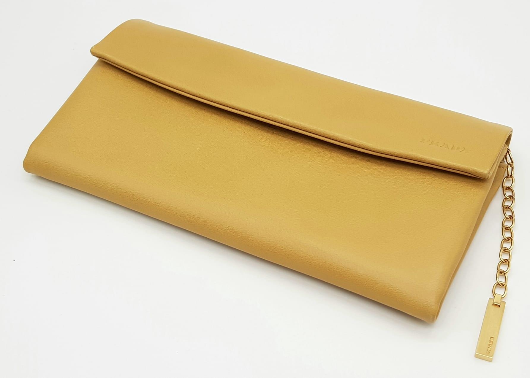 A Prada Brown Leather Clutch Bag in Box. Soft brown leather with gilded hardware. 20cm width by 11cm - Image 2 of 9