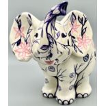 A very cute (the cutest ever!) ceramic elephant money box with lots and lots of coins from over 35