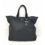 A Prada Black Leather Tote Bag. Soft black leather with gilded hardware. Large inner zipped