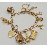 A 9K Yellow Gold Charm Bracelet with Heart Clasp. 10 charms including the Cat and the Fiddle!