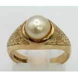 A Vintage 9K Yellow Gold Pearl Solitaire Ring. Scroll decoration. Size K. 4.29g total weight.