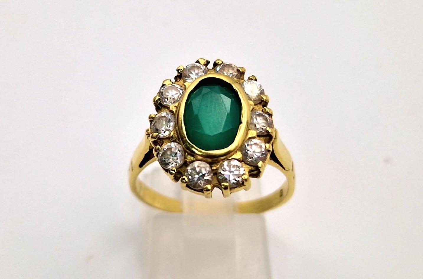 An 18 K yellow gold, stone set cluster ring. Size: Q, weight: 5.6 g. - Image 2 of 7