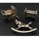 SELECTION OF 3 STERLING SILVER CHARMS ALL BABY RELATED CRIB, PRAM THAT OPENS AND A ROCKING HORSE 7.
