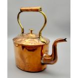 AN ANTIQUE COPPER KETTLE WITH BRASS TRIM. SEEMS TO HAVE HAD SOME SOLDERING. A/F 28cms TALL 27cms