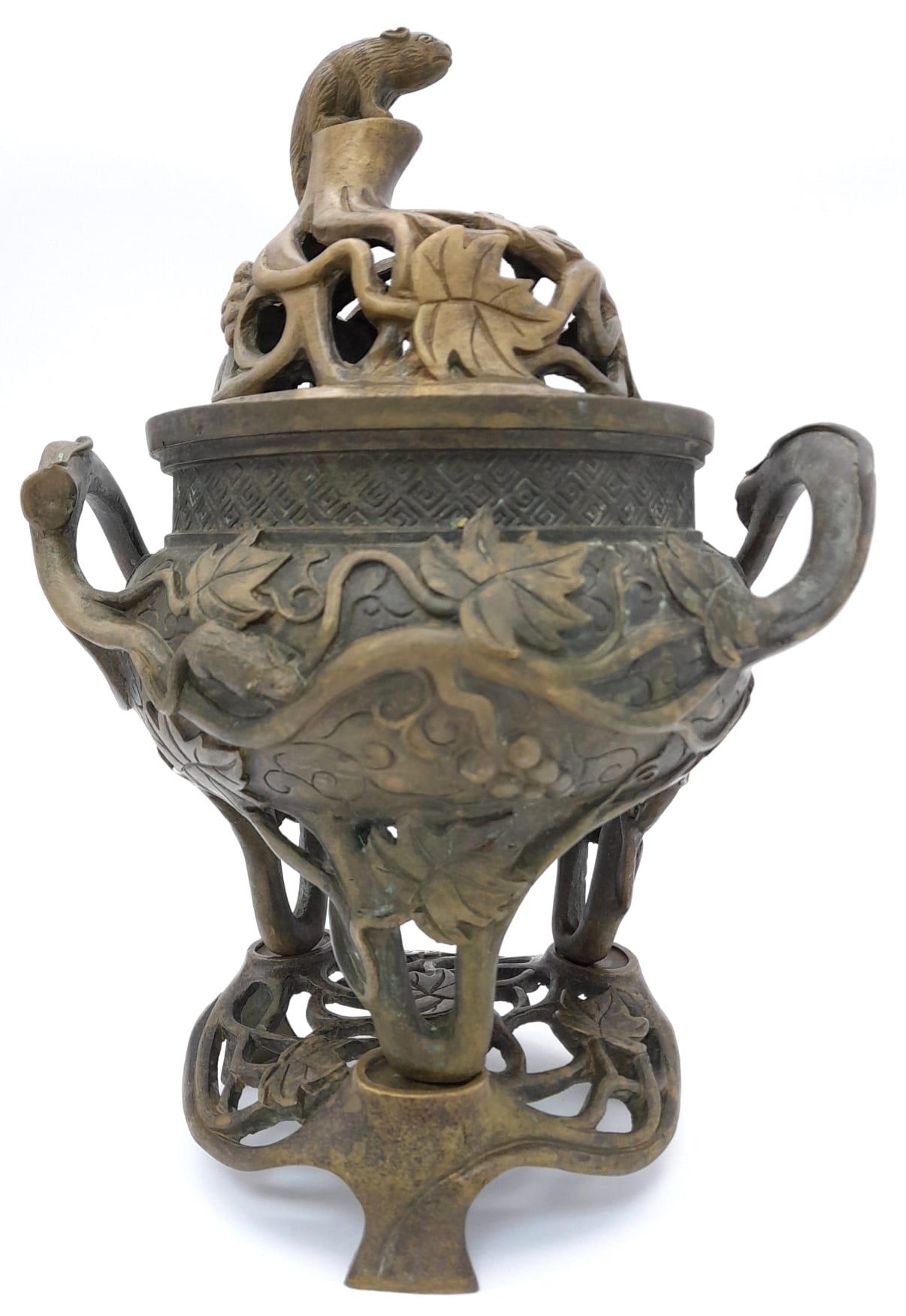 A Late Qing Dynasty Three Piece Bronze Censer. Rat at the apex overseeing a good harvest. 26cm tall.