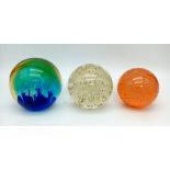 A lot of 3 Smooth round paperweights, Biggest is 10cm tall.