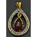Mexican fire opal (estimated 1.5ct) and diamonds pendent. 25mm. Ref: 2