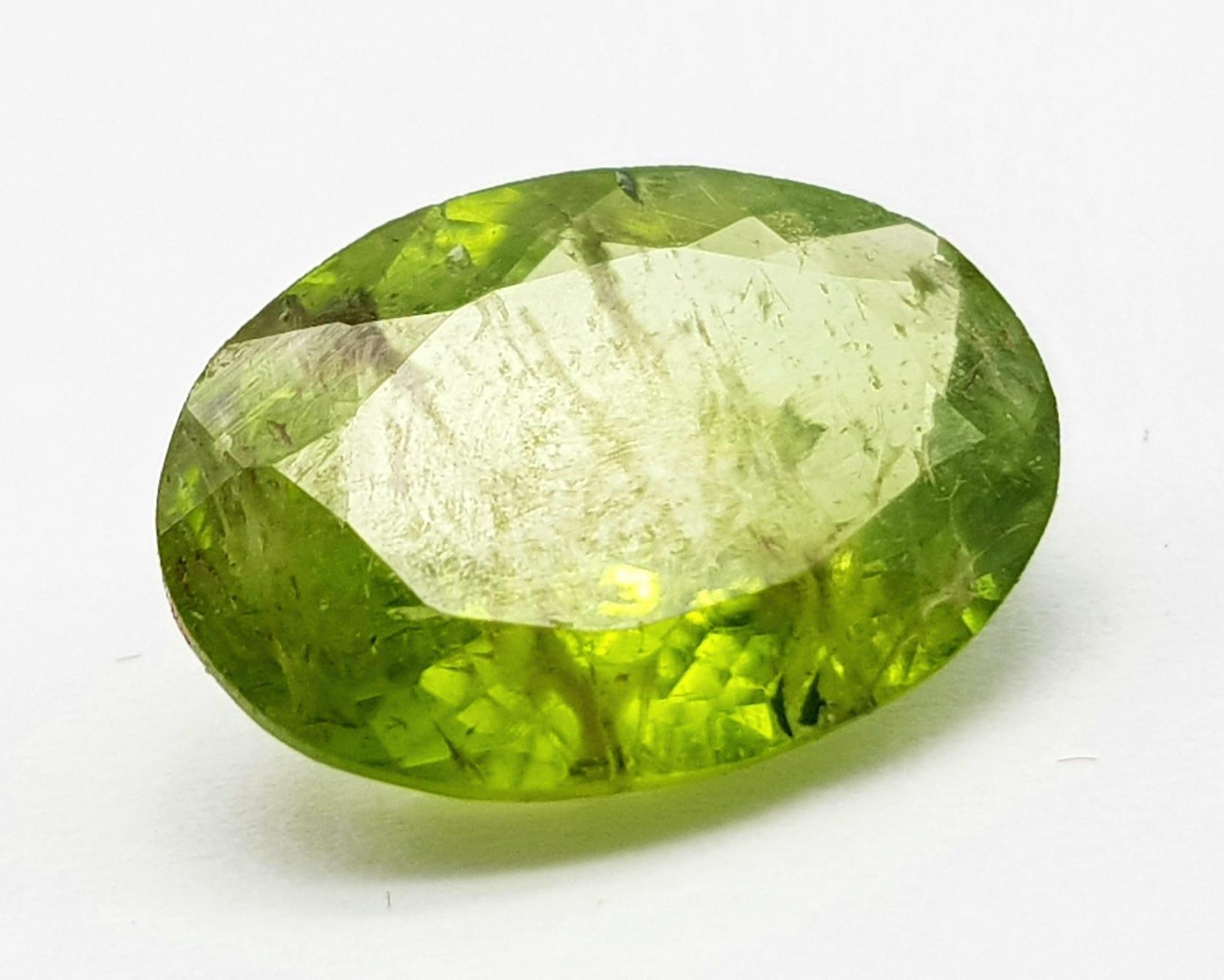 5.30 Ct Faceted Peridot. Olive Green. Oval Cut. Comes with GLI Certificate.
