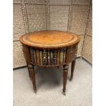 Maitland Smith Round Leather-Wrapped Book Motif Design Side Table on Castors. There are three sets