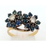 A vintage, 18 K yellow gold ring with a double cluster with diamonds (0.30 carats) and sapphires.