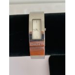 Ladies Quartz bracelet watch marked DKNY Model NY–4623, having square face with white dial. Finished