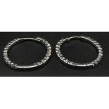 A 9 K white gold, topaz set, hoop earrings, weight: 4.2g.