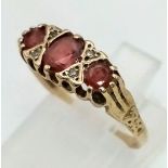 An Antique 9K Yellow Gold, Garnet and Diamond Ring. Size O. 1.57g total weight.