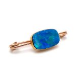 An Antique 9K Rose Gold and Possibly Opal Bar Brooch. Rectangular shimmering blue opal. 4cm brooch