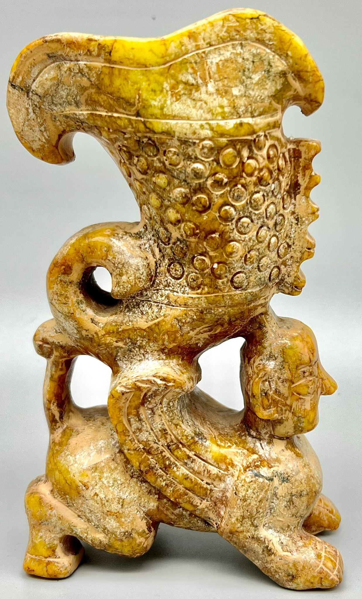 A Chinese, ceremonial, libation cup. Hand carved in great detail on hard stone (possibly jade), from