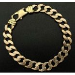 A Heavy 9K Yellow Gold Flat Curb Link Gents Bracelet. 24cm. 54.05g.