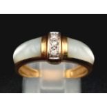 A 9K yellow gold diamond and mother of pearl set ring. Size: N, weight: 3.4 g.