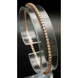 AN 18K ROSE GOLD AND DIAMOND TENNIS BRACELET WITH APPROX 3ct OF HIGH QUALITY DIAMONDS. 8.0gms 18cms