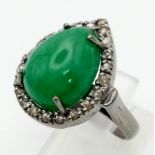 A 6.80ct Natural Emerald Cabochon Ring set in 925 silver and decorated with a 0.28ct Diamond