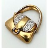 A 9 K yellow gold, stone set, hand bag charm, weight; 2.1 g.