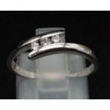 PLATINUM DIAMOND TWIST RING. 0.10CT DIAMOND. TOTAL WEIGHT 2.9G. SIZE M