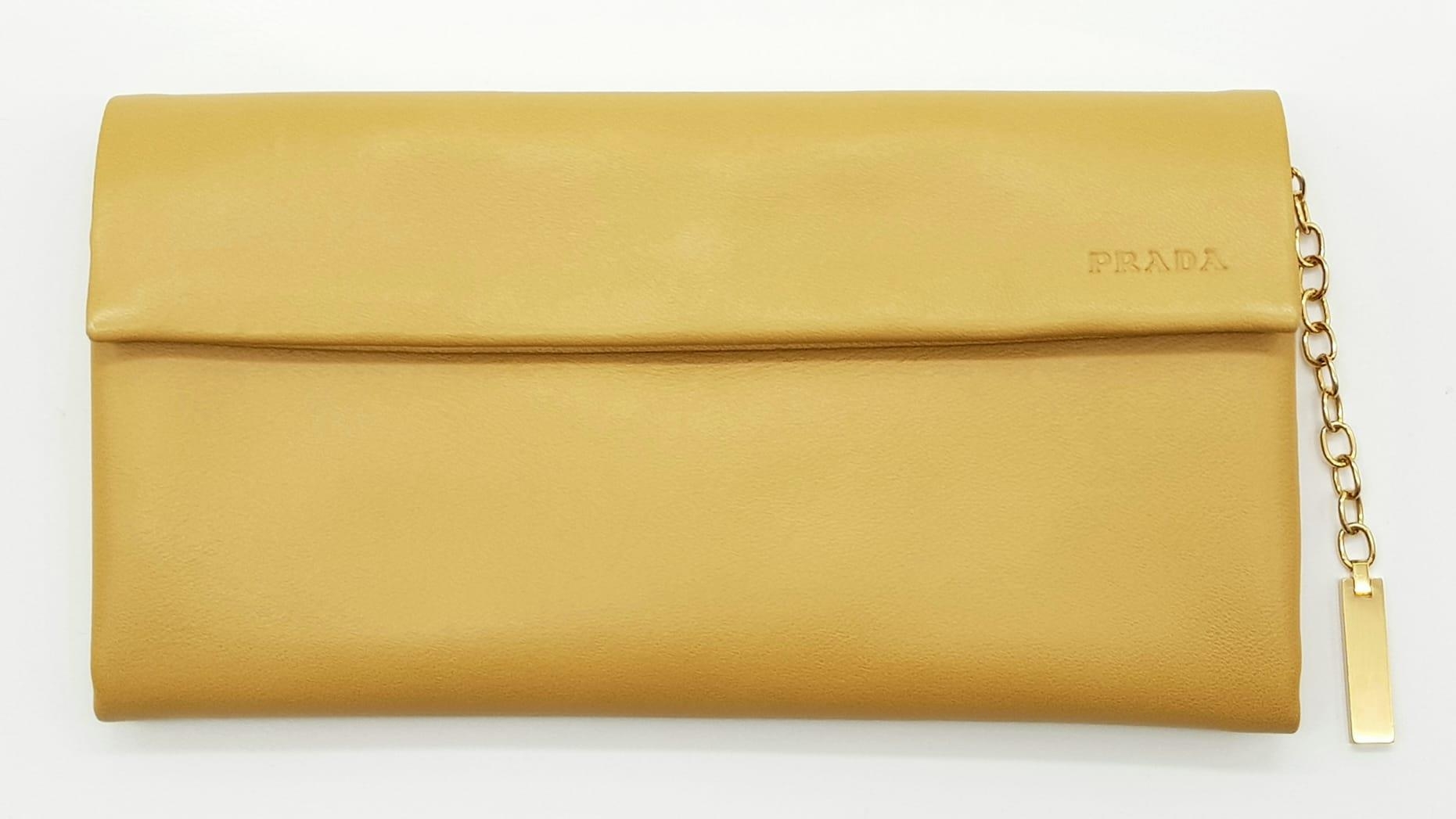 A Prada Brown Leather Clutch Bag in Box. Soft brown leather with gilded hardware. 20cm width by 11cm