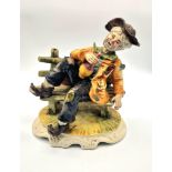 A Large Capodimonte - Tramp on a Bench Figure. 26cm x 24cm.