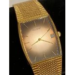 Gentlemans ACCURIST MB347 Quartz Wristwatch In gold tone, having square face with date window and