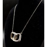 Two Vintage Tiffany and Co 1837 - 925 Silver, Square Pendants on a silver chain.