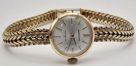 A Wonderful Vintage 9K Gold Garrad Ladies Watch. 9k gold foxtail bracelet. 9K gold case - 20mm. 17
