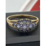 9 carat GOLD RING Having Tanzanite coloured gemstones cluster set to top. Full UK hallmark. Complete