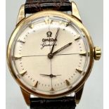 A Vintage Omega Geneve Gold Gents Watch. Leather strap. Gold case - 34mm. Cream dial with sub second
