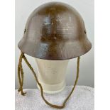 WWII JAPANESE IMPERIAL ARMY HELMET IN MINT CONDITION WITH ORIGINAL TEA-GREEN PAINT, WOVEN HEMP INNER