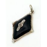 An Art Deco, Enamel, Diamond, 18k gold and Platinum Pendant. 3cm. 2.34g total weight.