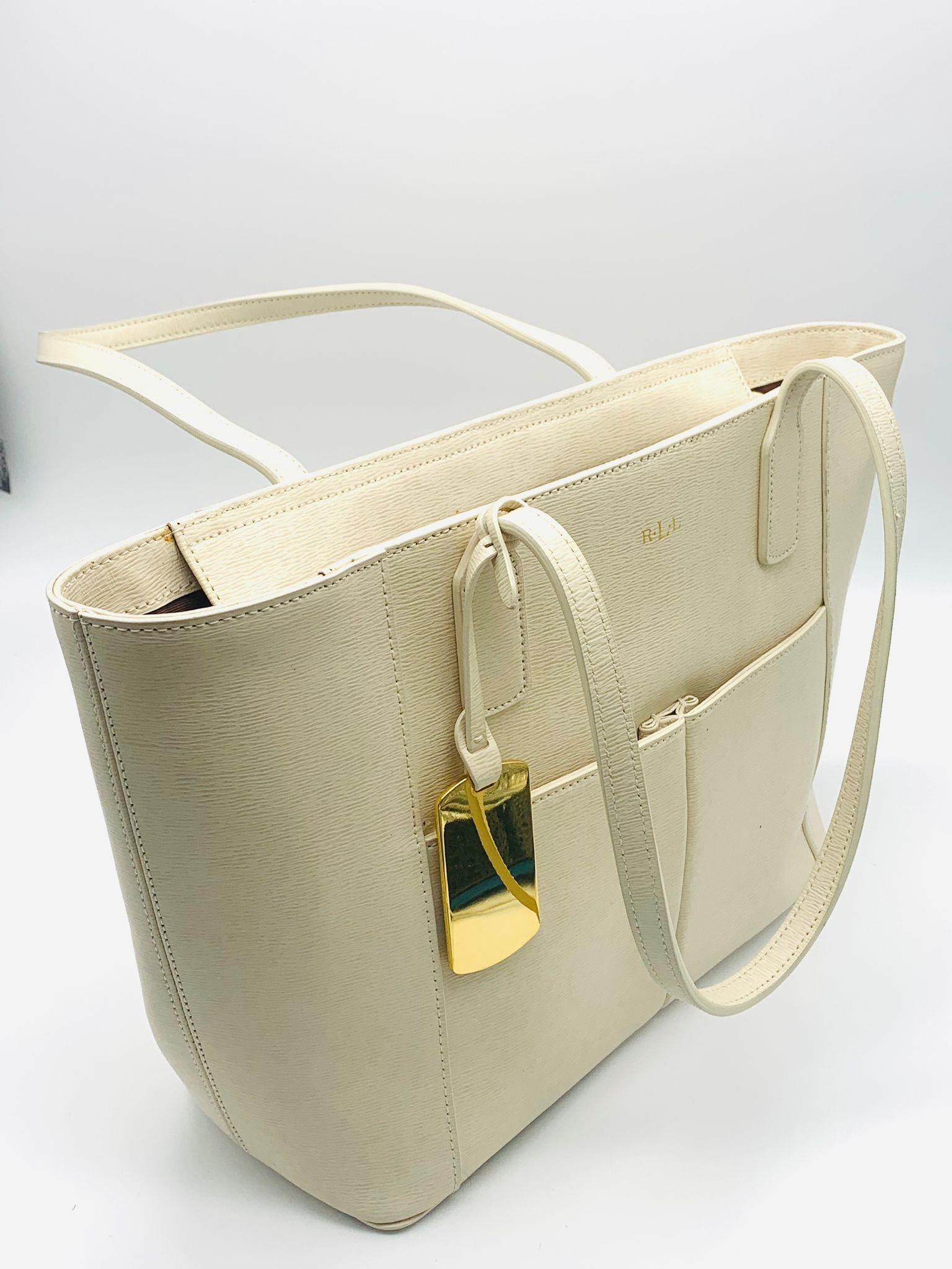 A Ralph Lauren Cream Leather Handbag. Two exterior flaps. Zipped inner compartment. 36cm width. 26cm - Image 3 of 12