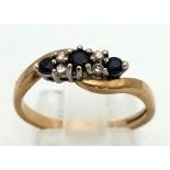 A 9 K yellow gold diamond and sapphire ring. Size: N, weight: 2.3 g.