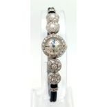 A Vintage Jaeger Le Coultre Ladies Diamond Dress Watch. Cloth and metal bracelet. Case - 14mm.