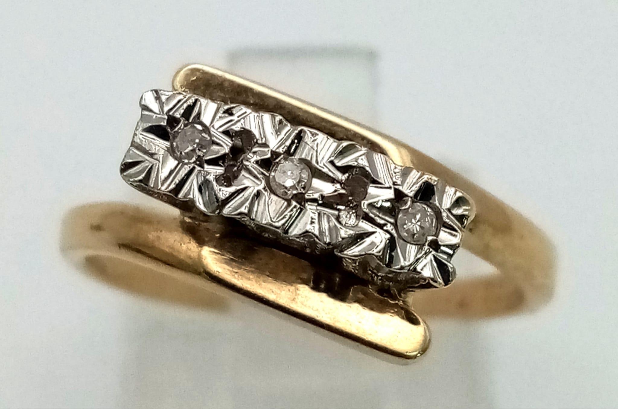 A mid century star set diamond ring set in 9k yellow gold, Ring Size N, Total Weight 2.8 grams.