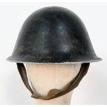 A British Army Mark IV steel helmet with maker’s mark RO (Rubery Owen) and dated 1945. With later