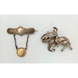 Two Antique Silver Brooches. A George V 1914 Threepence Coin Hanging Brooch and a Jousting Knight.